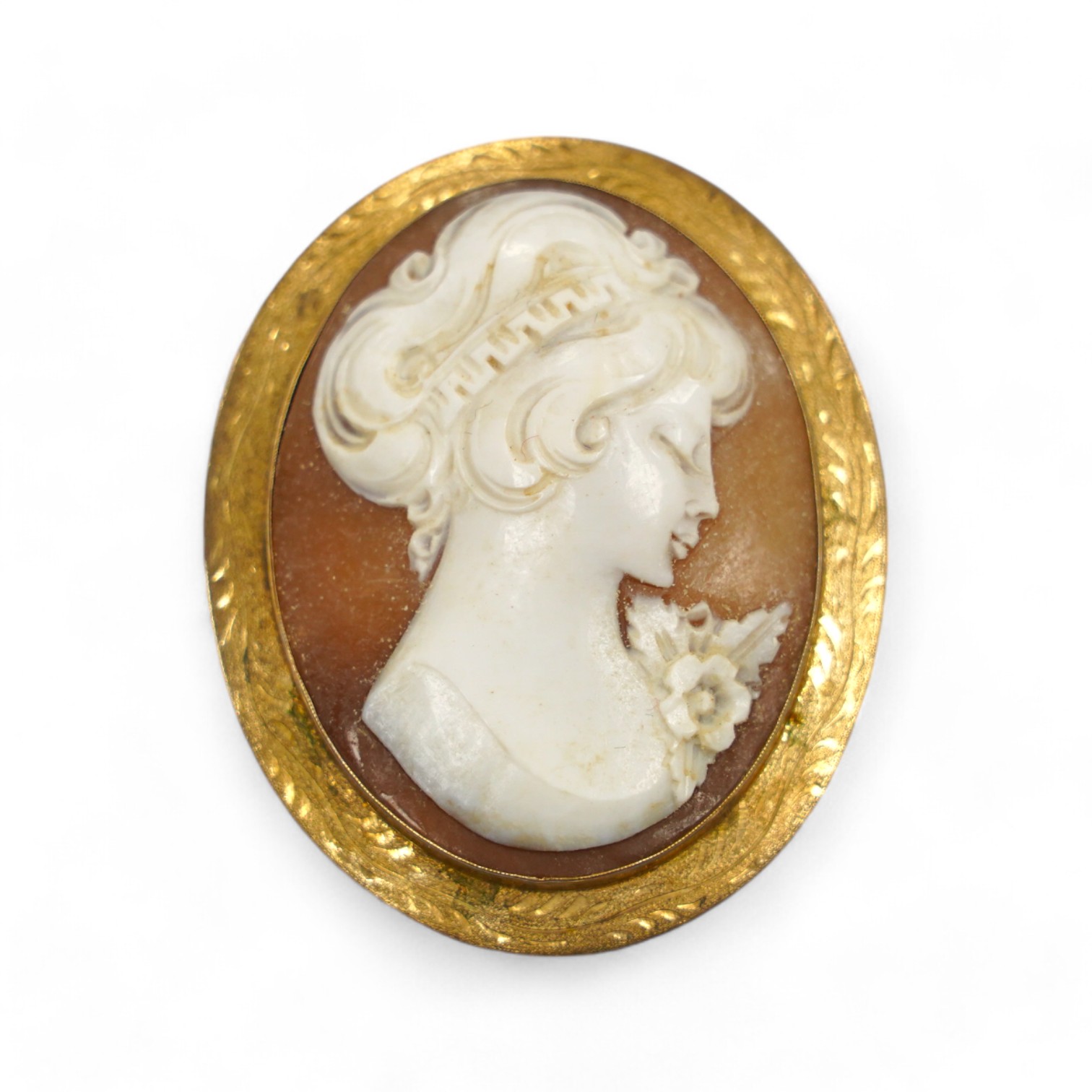 A modern engraved 9ct gold mounted oval cameo shell brooch, 59mm, gross weight 15.8 grams. Condition - fair